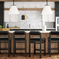 Four black Marlowe bar stools by Vogel placed at a modern kitchen island.